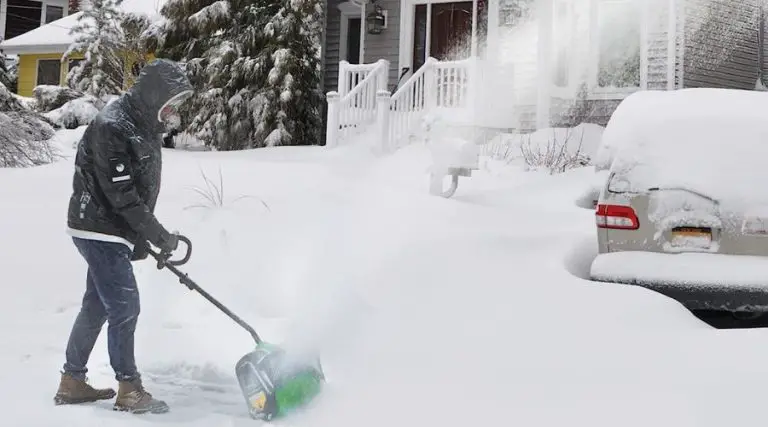 An image showing a man using Greenworks Pro 80V 12 inch Cordless Snow Shovel, one of the best cordless snow shovel