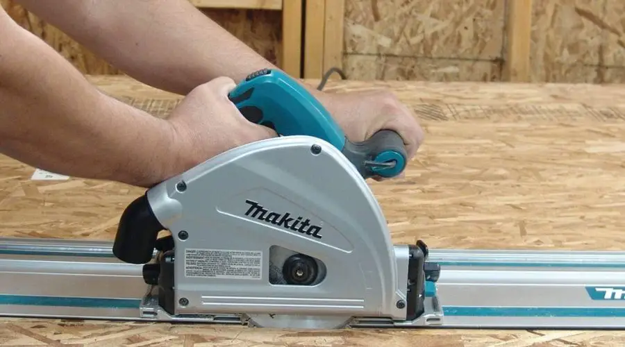 An image showing Makita SP6000J1 6-1/2" Plunge Circular Saw Kit, with Stackable Tool case and 55" Guide Rail, one of the best cordless track saw