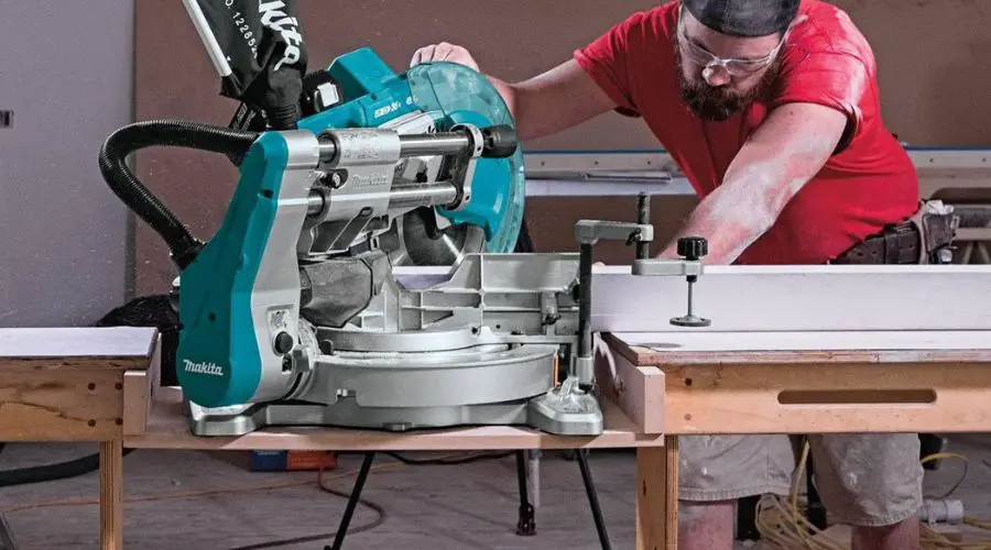 A person using Makita XSL06PT 18V x2 LXT Lithium-Ion, one of the best cordless miter saw to cut wood