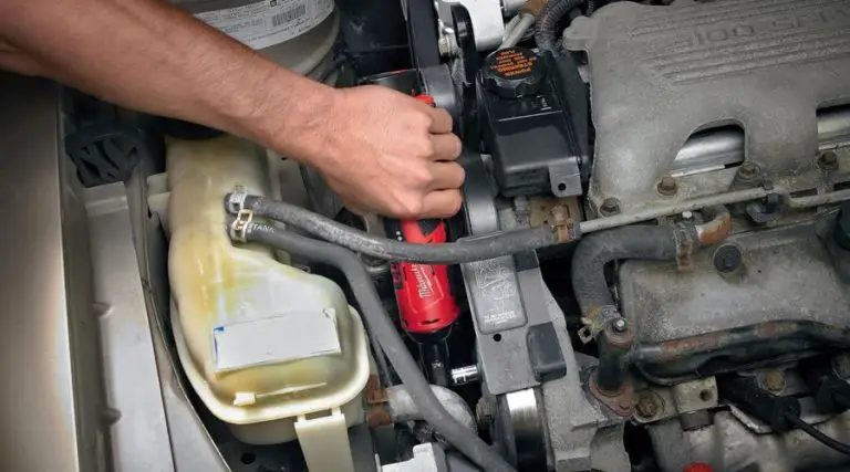 An image showing a mechanic using Milwaukee 2457-20 M12 Cordless 3/8" Sub-Compact 35 ft-Lbs 250 RPM Ratchet w/ Variable Speed Trigger, one of the best cordless ratchet model in a car